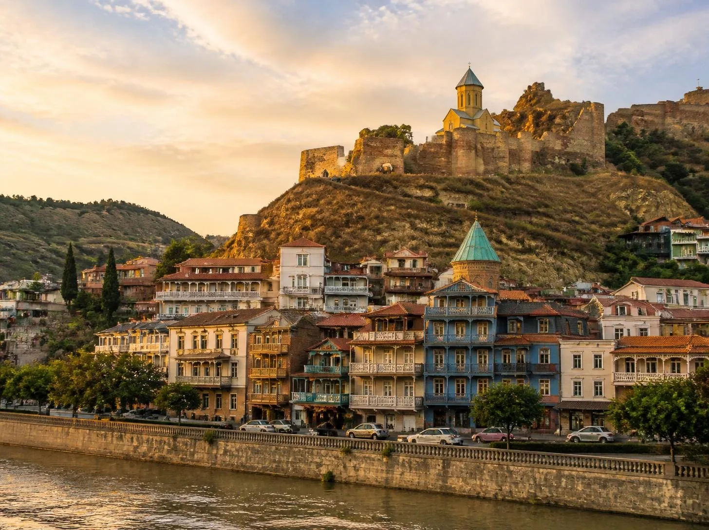 Old Tbilisi houses and Narikala Fortress at sunset, Georgia