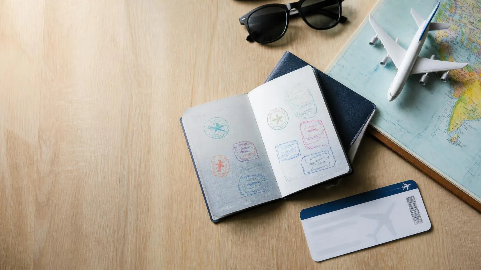 Passport with travel stamps and a boarding pass